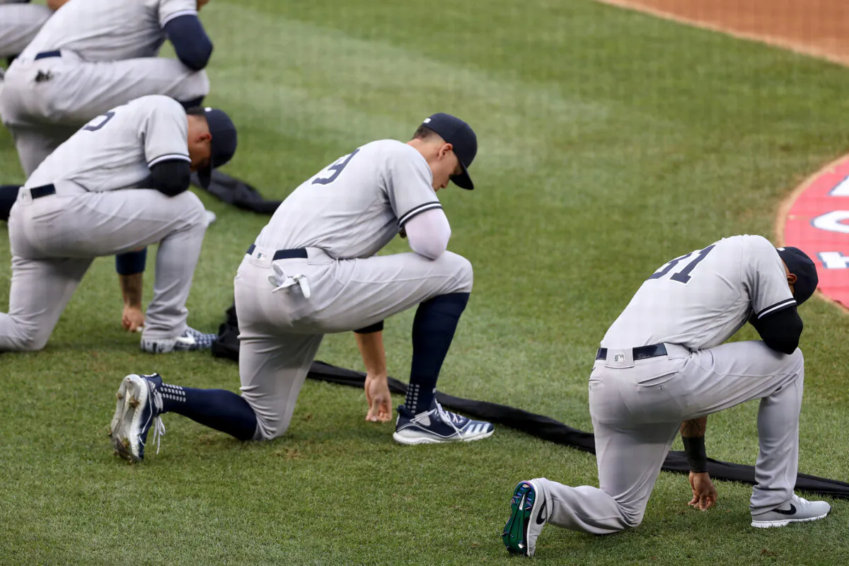 The New York Yankees kneel prior to the game against the Washington Nationals at Nationals Park, in Washington, D.C., on July 23, 2020. (Rob Carr/Getty Images)