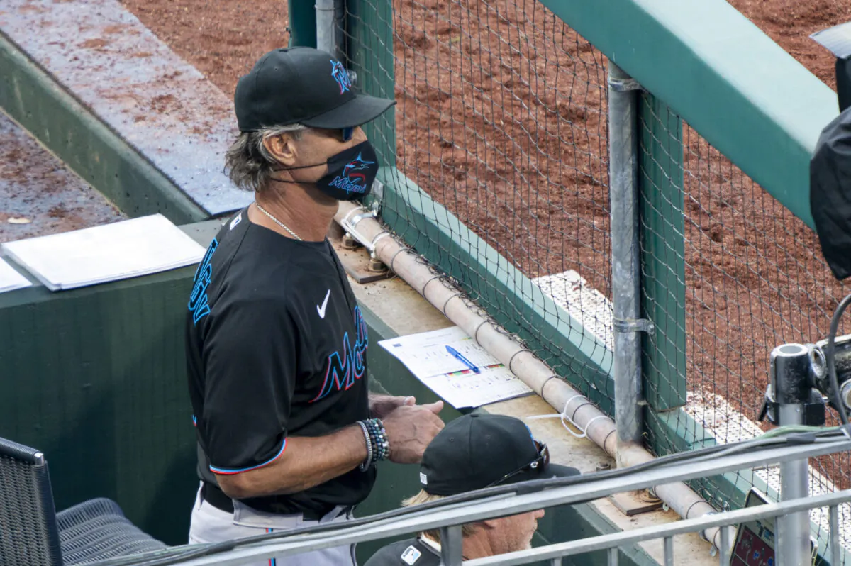 Miami Marlins' manager Don Mattingly looks out from the dugout during the eighth inning of a baseball game against the Philadelphia Phillies, in Philadelphia, Pa., on, July 25, 2020. (Chris Szagola/AP Photo)