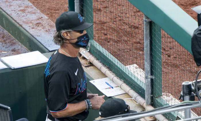 Miami Marlins' manager Don Mattingly looks out from the dugout during the eighth inning of a baseball game against the Philadelphia Phillies, in Philadelphia, Pa., on, July 25, 2020. (Chris Szagola/AP Photo)
