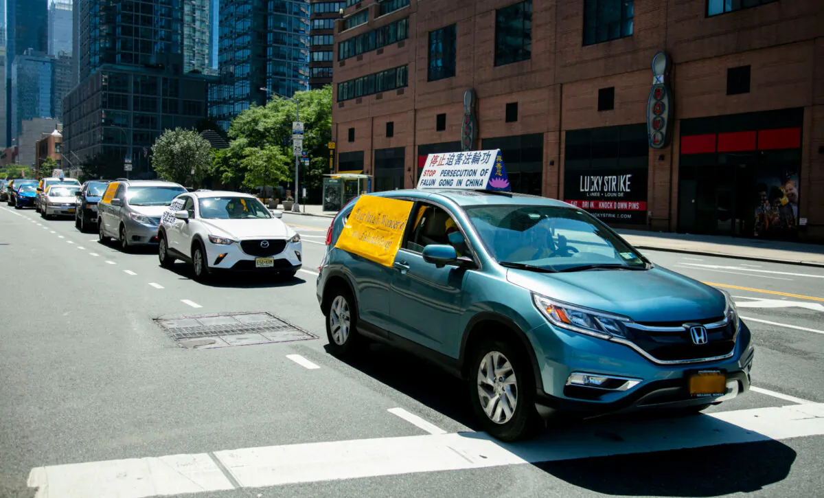 Falun Gong practitioners tour around New York in a car parade to commemorate the 21st year of the persecution in China, on July 18, 2020. (Zhang Binqian/The Epoch Times)