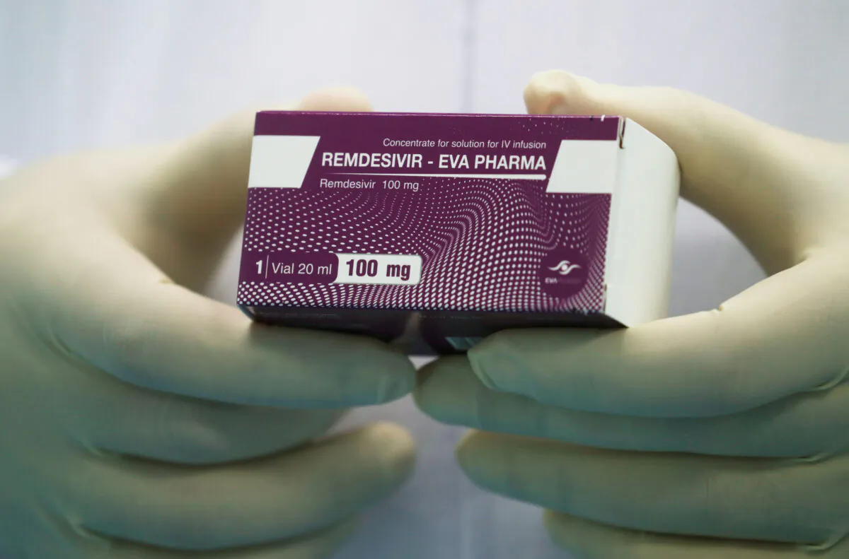 A lab technician holds the COVID-19 treatment drug "Remdesivir" at Eva Pharma Facility in Cairo, Egypt, on June 25, 2020. (Amr Abdallah Dalsh/Reuters)