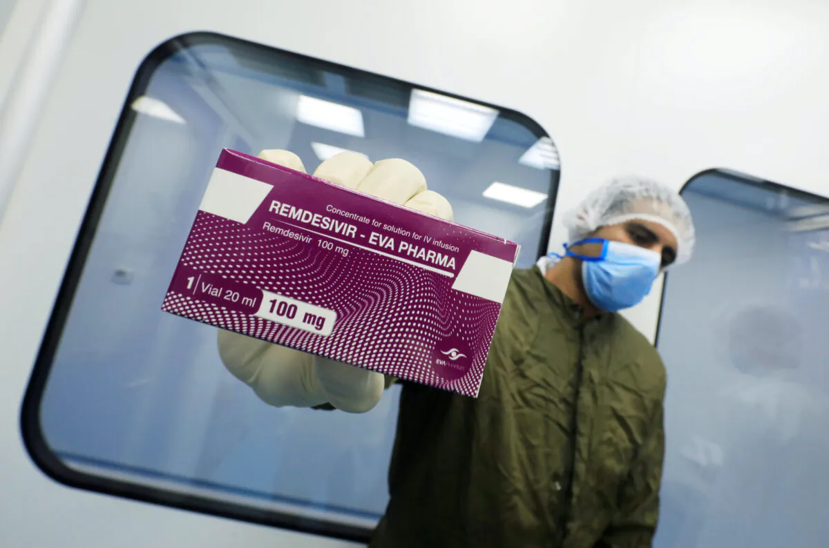 A lab technicians holds the COVID-19 treatment drug Remdesivir at Eva Pharma Facility in Cairo, Egypt, June 25, 2020. (Amr Abdallah Dalsh/Reuters)