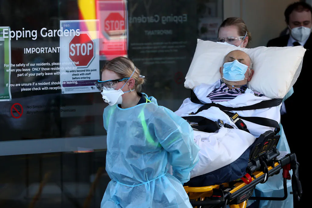 A resident is taken from the Epping Hardens Aged Care Home on July 29, 2020 in Melbourne, Australia. (Robert Cianflone/Getty Images)
