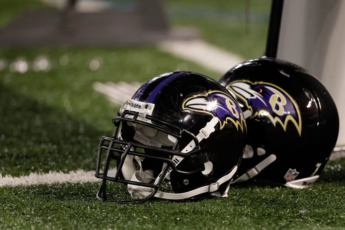A pair of Baltimore Ravens helmets sit on the sidelines during the Ravens game against the Washington Redskins at M&T Bank Stadium  in Baltimore, Md., on August 25, 2011. (Rob Carr/Getty Images)
