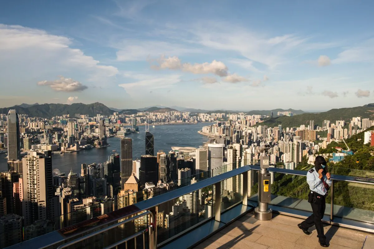 A member of security walks along a viewing platform on Victoria Peak in Hong Kong on July 28, 2020. (Anthony Wallace/AFP via Getty Images)
