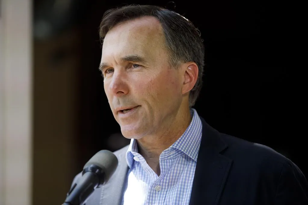 Finance Minister Bill Morneau speaks to media during a press conference in Toronto, on July 17, 2020. In the wake of revelations that Morneau and his family participated in trips overseas sponsored by the WE organization, experts in the charitable sector say covering a donor's travel costs is not a usual practice for charities. (Cole Burston/The Canadian Press)