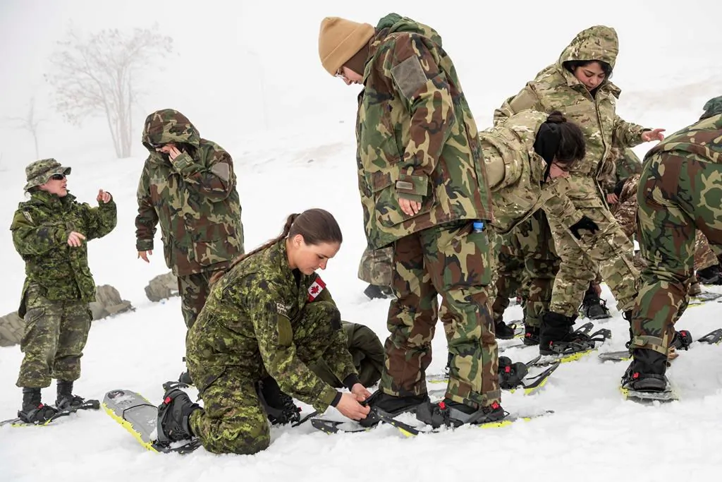 Cpl. Brenna Baverstock of the Winter Mobile Training Team conducts a snowshoe lesson for the soldiers of the Lebanon Border Regiment in the Bcharre region of Lebanon, on February 17, 2020. Canada's war against the Islamic State of Iraq and the Levant has quietly entered a new phase, resulting in plans to keep fewer troops in the Middle East even after the COVID-19 pandemic passes. (The Canadian Press/HO-Department of National Defence-Cpl. Nicolas Alonso)