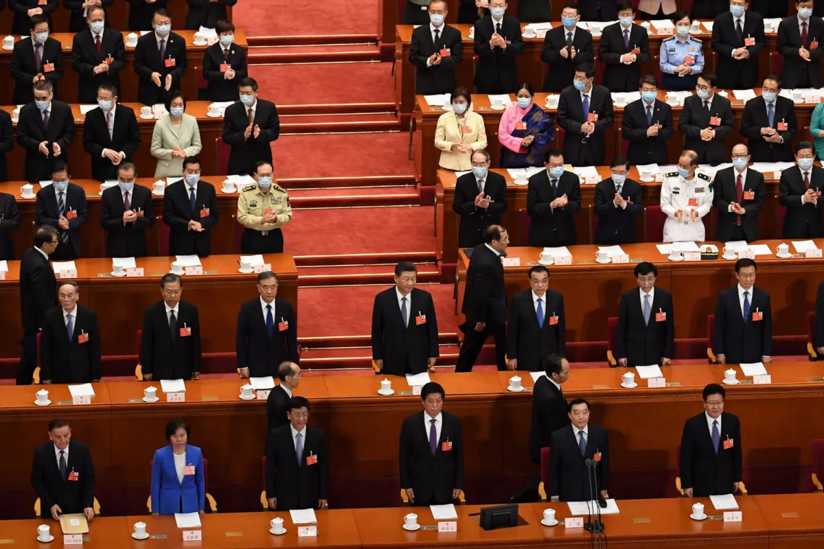 CCP leader Xi Jinping (C) arrives during the second plenary session of the country's rubber-stamp congress in the Great Hall of the People in Beijing on May 25, 2020. (Noel Celis /AFP via Getty Images)