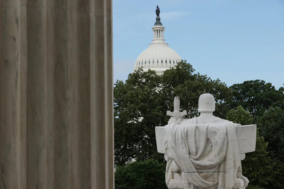 The statue Authority of Law on the steps of the Supreme Court overlooks the U.S. Capitol on June 15, 2020.   (Chip Somodevilla/Getty Images