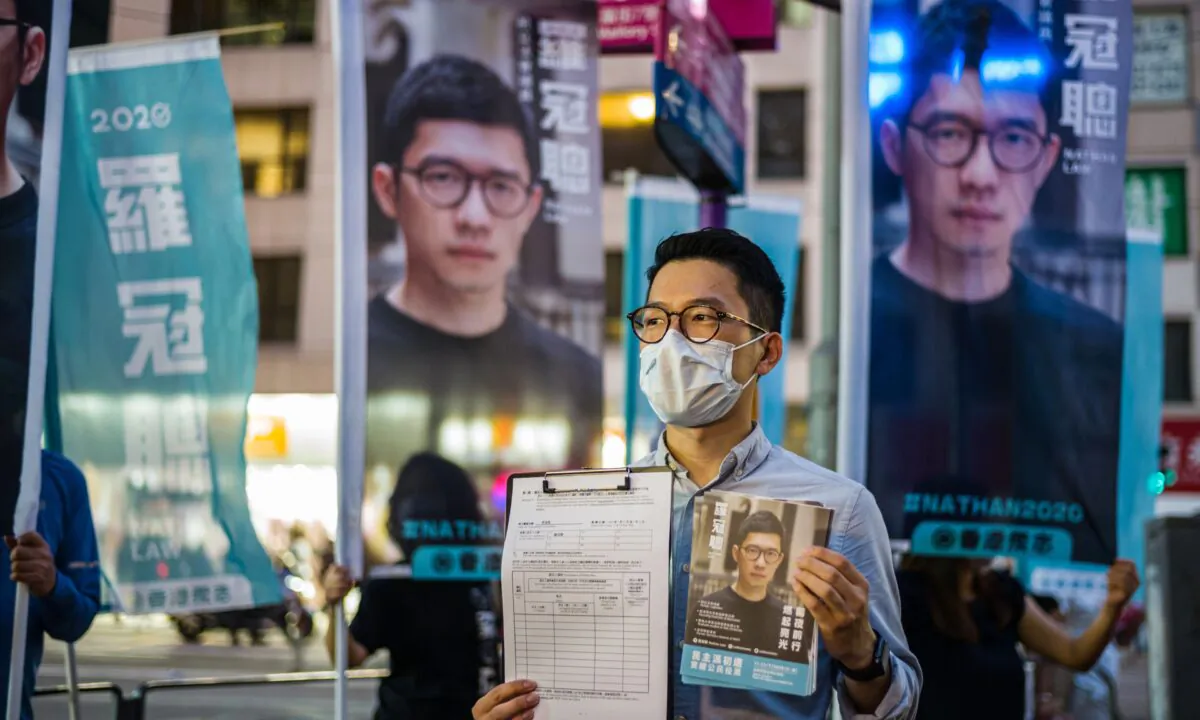 Member of the pro-democracy political organization Demosisto and disqualified lawmaker Nathan Law speaks to reporters in Hong Kong on June 19, 2020. (Anthony Wallace/AFP via Getty Images)