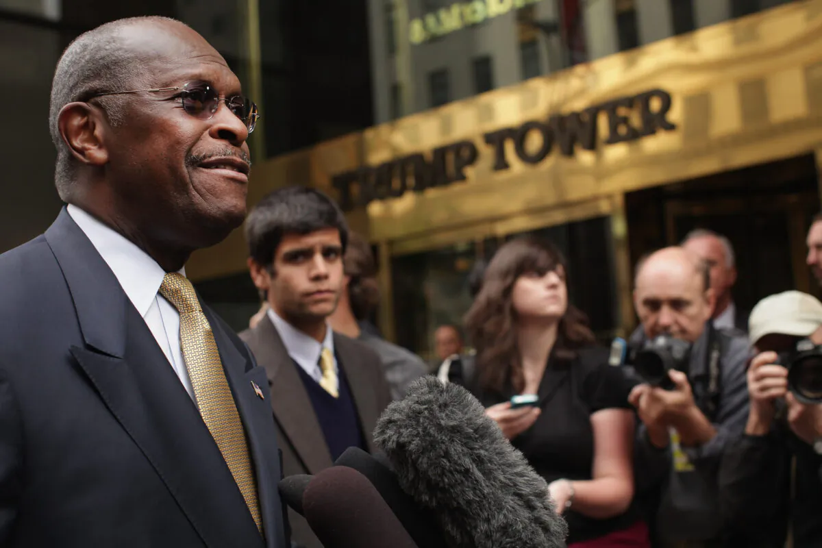 Republican presidential candidate Herman Cain speaks to the media outside of Trump Towers before a scheduled appearance with real estate mogul Donald Trump in New York City, N.Y., on Oct. 3, 2011. (Spencer Platt/Getty Images)