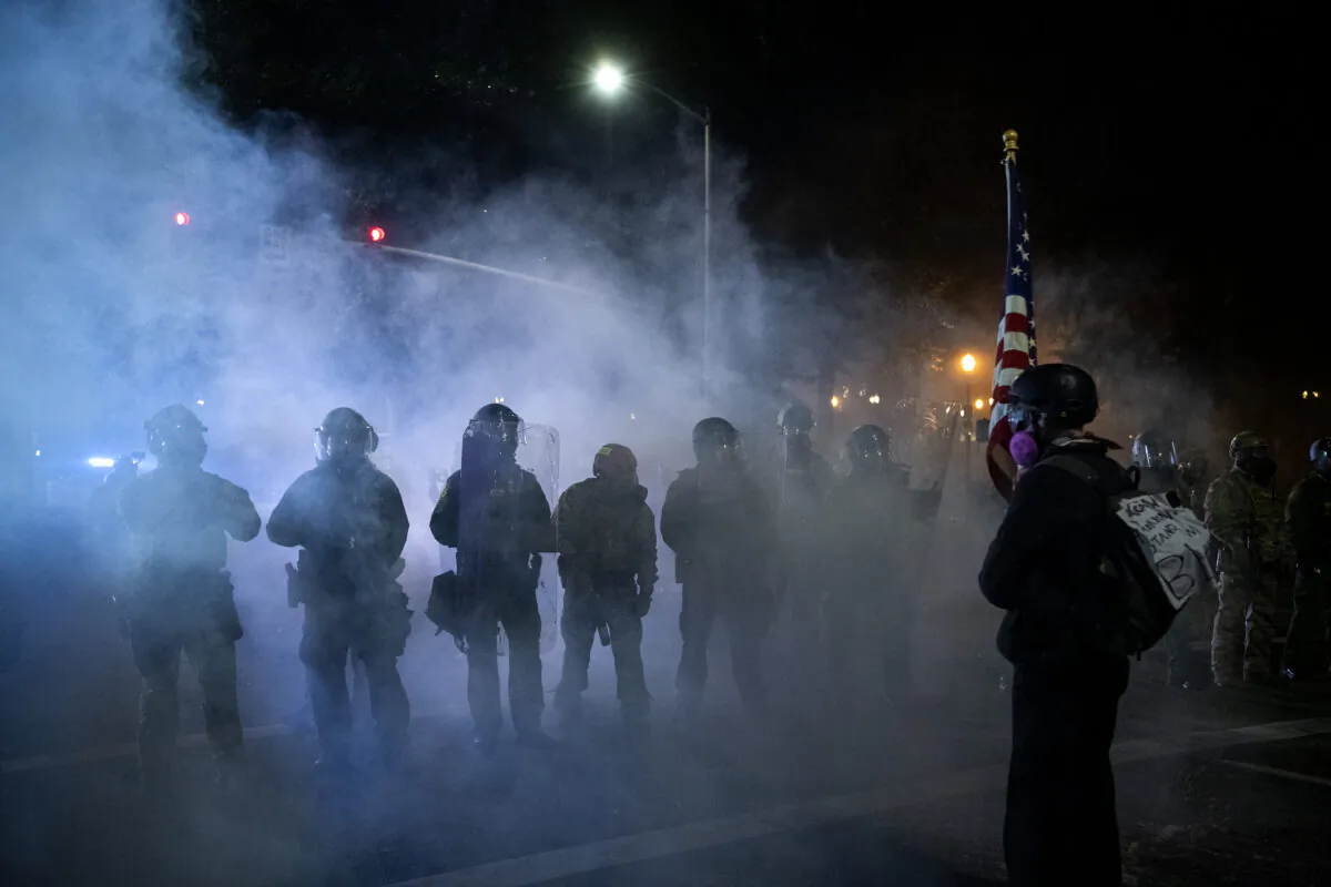 Federal law enforcement dispense tear gas as they confront demonstrators in Portland, Ore., on July 29, 2020. (Alisha Jucevic/AFP via Getty Images)