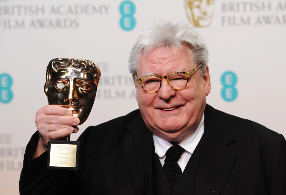 Sir Alan Parker, winner of the Fellowship award, poses in the press room at the EE British Academy Film Awards at The Royal Opera House in London, on Feb. 10, 2013. (Stuart Wilson/Getty Images)