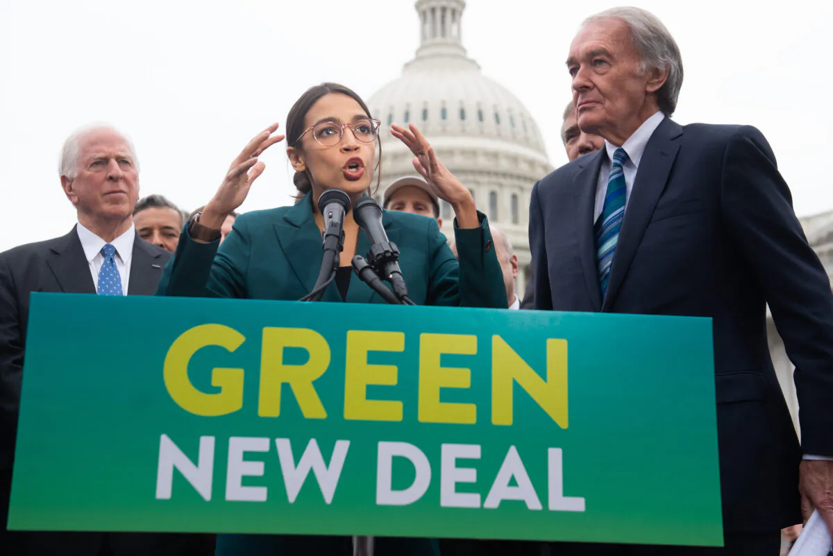 U.S. Rep. Alexandria Ocasio-Cortez (D-N.Y.) and U.S. Sen. Ed Markey (D-Mass.) (R) speak during a press conference to announce Green New Deal legislation, outside the U.S. Capitol in Washington on Feb. 7, 2019. (Saul Loeb/AFP via Getty Images)