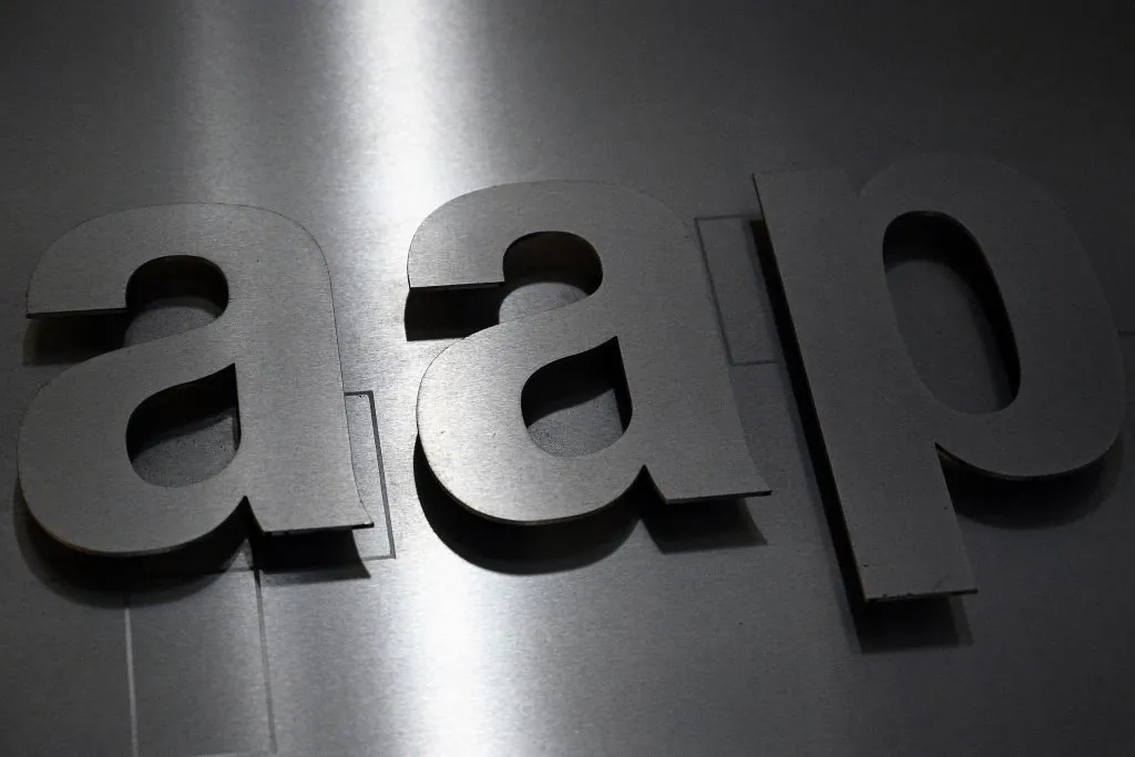 The Australian Associated Press (AAP) logo is seen outside the news agency's office in Sydney on June 30, 2020. (SAEED KHAN/Getty Images)