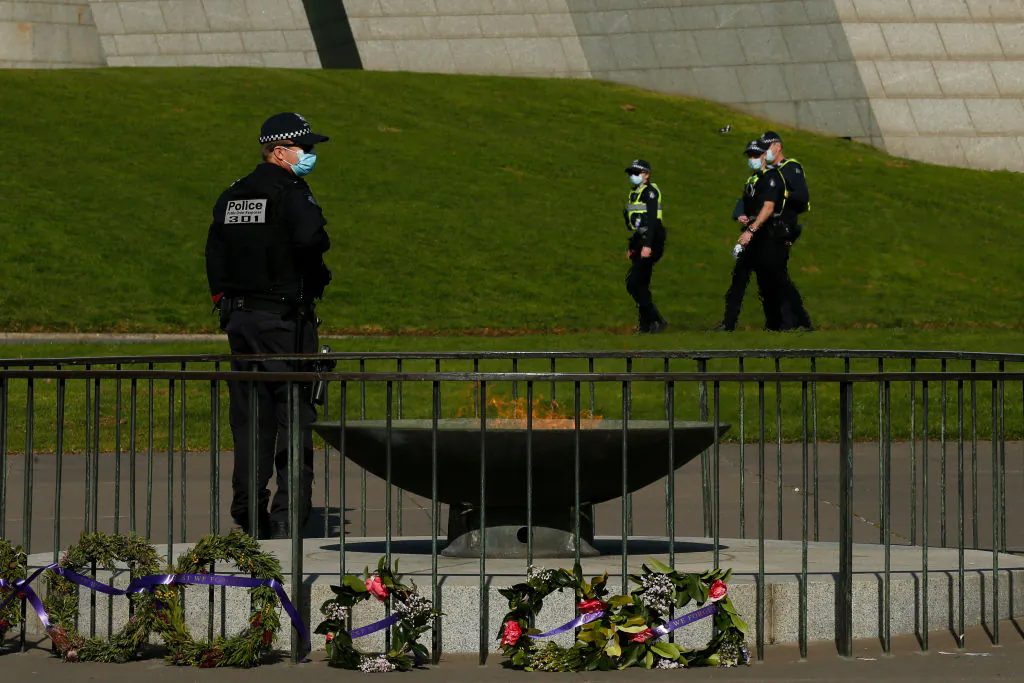 Members of Victoria Police patrol around the Shrine of Remembrance enforcing COVID restrictions on July 31, 2020, in Melbourne. (Darrian Traynor/Getty Images)