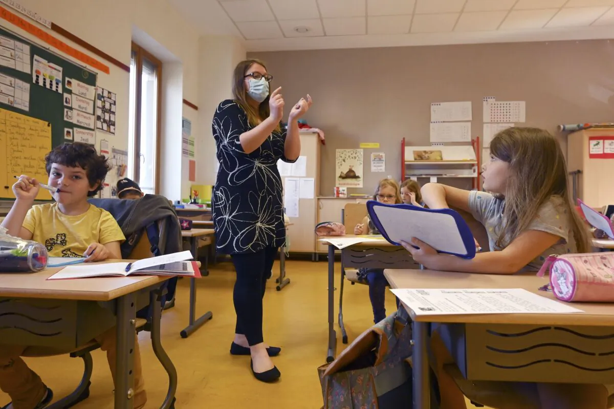 A teacher gives a lesson to the pupils at the Ziegelau elementary school in Strasbourg, France on June 22, 2020. (Frederick Florin/AFP via Getty Images)
