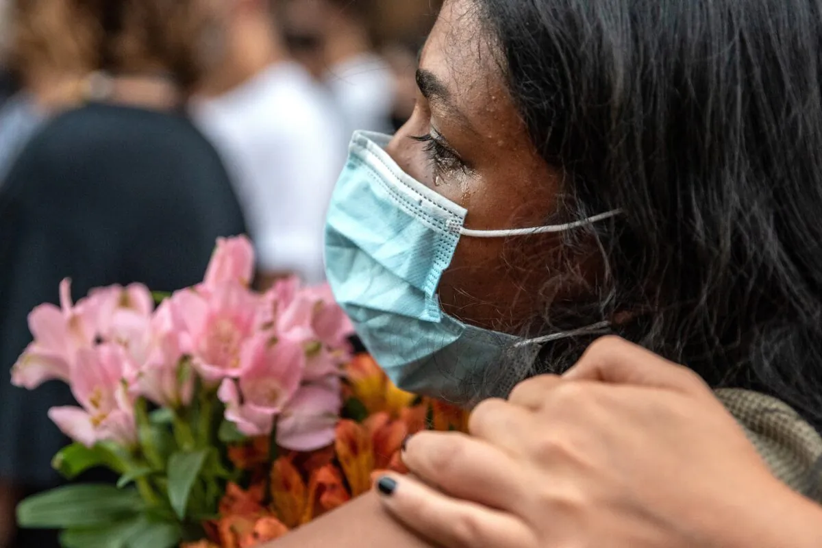 An attendee cries at a vigil for Garrett Foster in downtown Austin, Texas on July 26, 2020. (Sergio Flores/Getty Images)