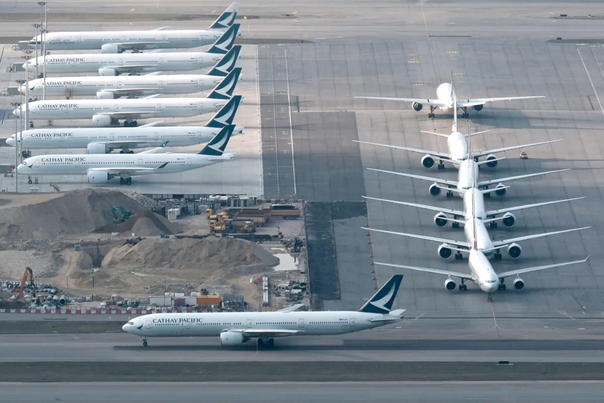 Cathay Pacific aircraft are seen parked on the tarmac at the airport, following the outbreak of the new coronavirus, in Hong Kong, China March 5, 2020. (Tyrone Siu/Reuters, File Photo)