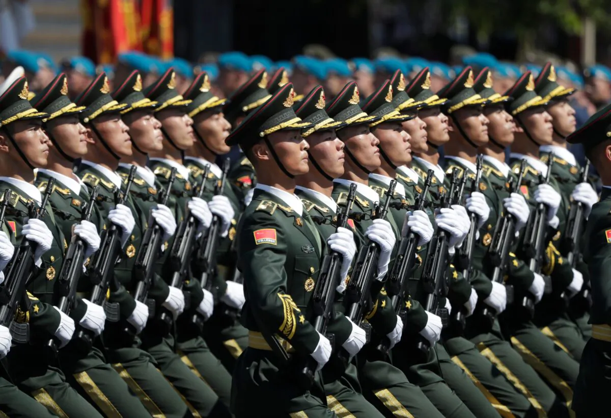 Soldiers from China's People's Liberation Army march on Red Square during a military parade, which marks the 75th anniversary of the Soviet victory over Nazi Germany in World War II, in Moscow on June 24, 2020. (Pavel Golovikin/POOL/AFP via Getty Images)