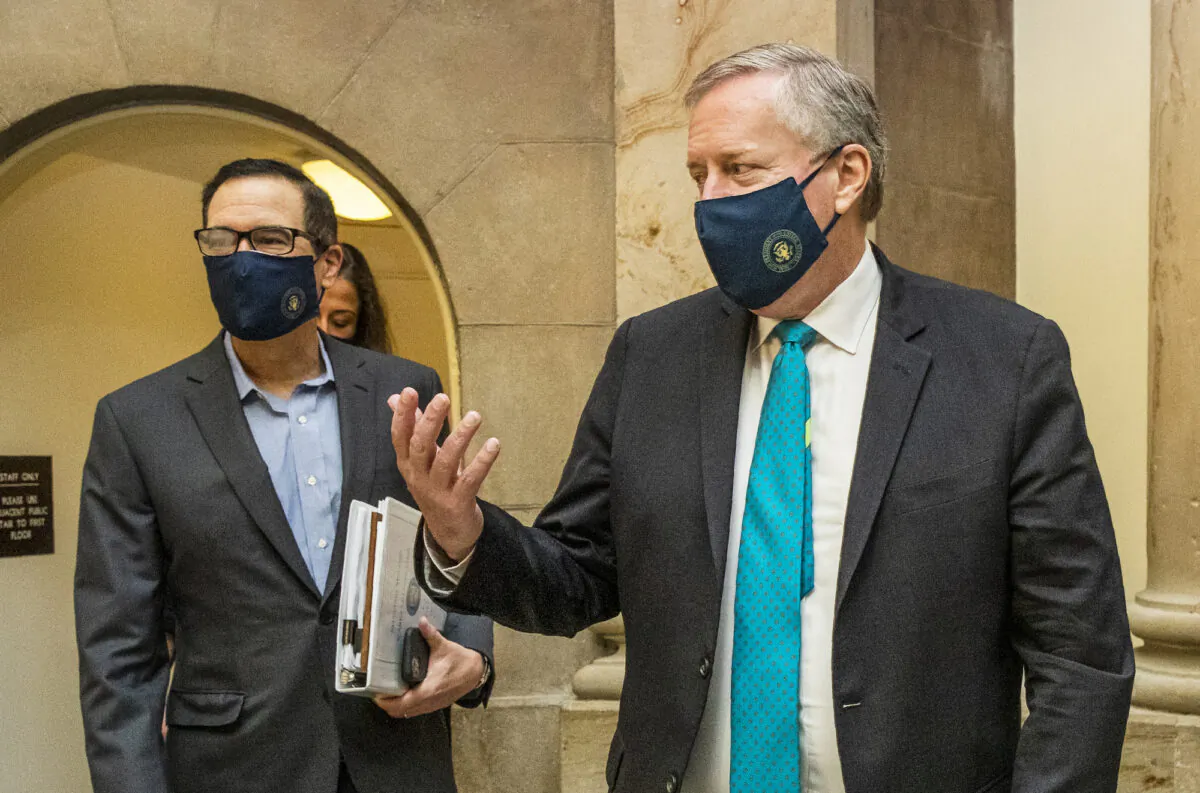 White House Chief of Staff Mark Meadows, right, and Treasury Secretary Steven Mnuchin, arrive at the office of House Speaker Nancy Pelosi at the Capitol to resume talks on a COVID-19 relief bill, in Washington, on Aug. 1, 2020. (Manuel Balce Ceneta/AP Photo)