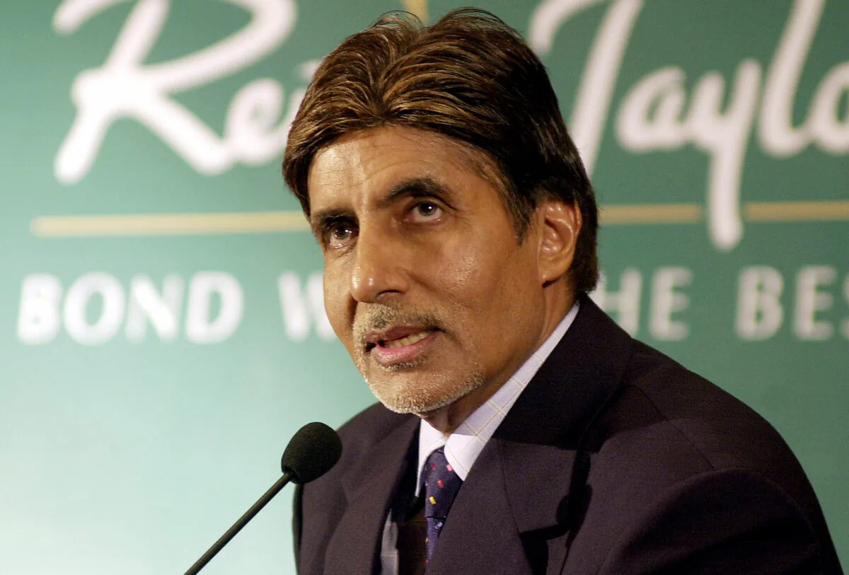Bollywood star Amitabh Bachchan answers questions following the announcement that he would become the new brand ambassador for luxury textiles manufacturer 'Reid And Taylor', in Bombay, on July 16, 2003. (Sebastian D'Souza/AFP via Getty Images)