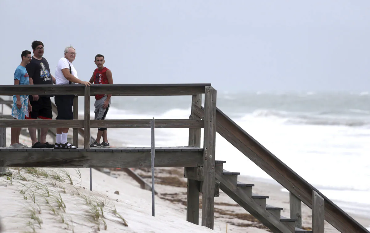 Beach goers watch waves churned up by Tropical Storm Isaias near Jaycee Beach Park, in Vero Beach, Fla., on Aug. 2, 2020. (Wilfredo Lee/AP Photo)