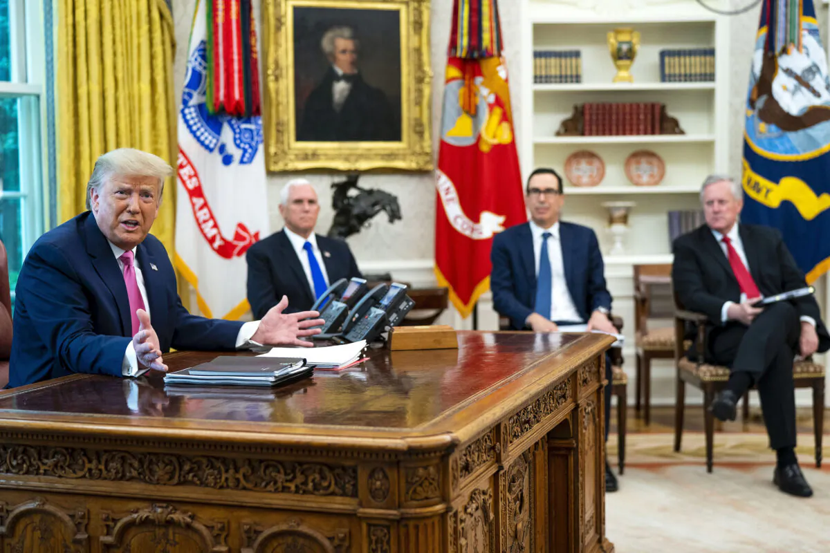 President Donald Trump talks to reporters while hosting (2nd L-R) Vice President Mike Pence, Treasury Secretary Steven Mnuchin, White House Chief of Staff Mark Meadows and Republican congressional leaders in the Oval Office at the White House on July 20, 2020. (Doug Mills-Pool/Getty Images)