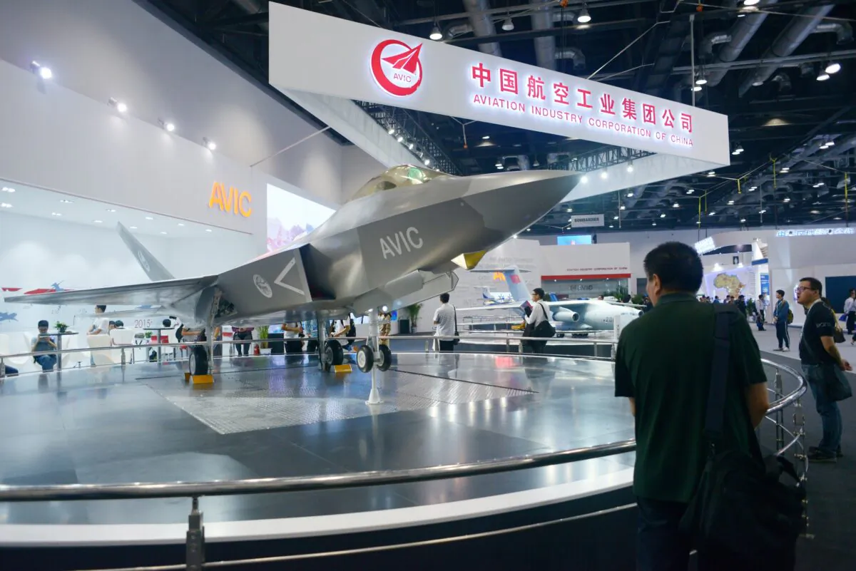 A man looks at a J-31 gyrfalcon stealth fighter plane model designed by Aviation Industry Corporation of China (AVIC) at the Beijing International Aviation Expo in Beijing on Sept. 17, 2015. (WANG ZHAO/AFP via Getty Images)