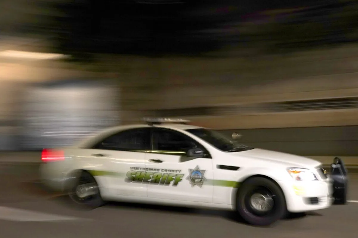 Portland, Ore., has had a 207 percent increase in homicides in the two-year period from 2019 to 2021. In this file photo a Multnomah County Sheriff's Office cruiser drives through the city in August, 2020. (Nathan Howard/Getty Images)