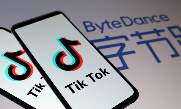 Tik Tok logos are seen on smartphones in front of a displayed ByteDance logo in this illustration taken Nov. 27, 2019. (Dado Ruvic/Illustration/File Photo/Reuters)