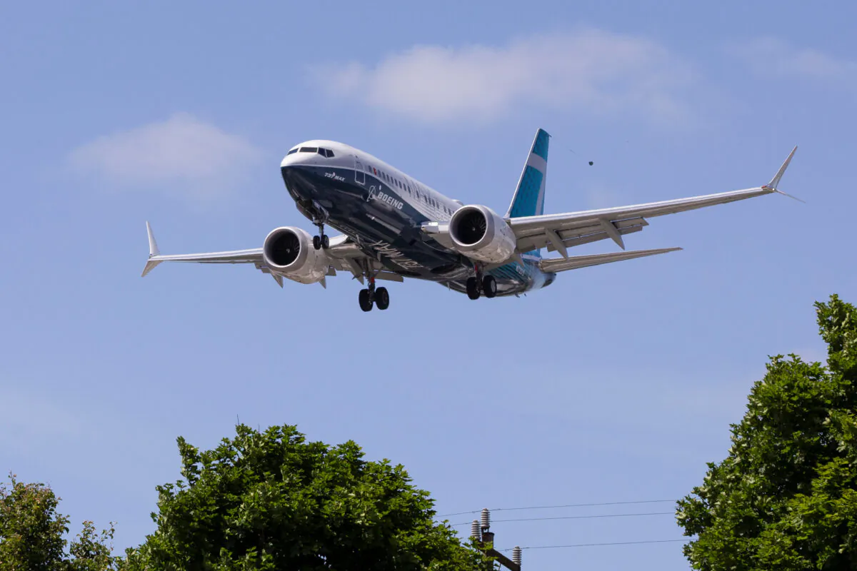 A Boeing 737 MAX airplane lands after a test flight at Boeing Field in Seattle, Wash., on June 29, 2020.  (Karen Ducey/File Photo/Reuters)