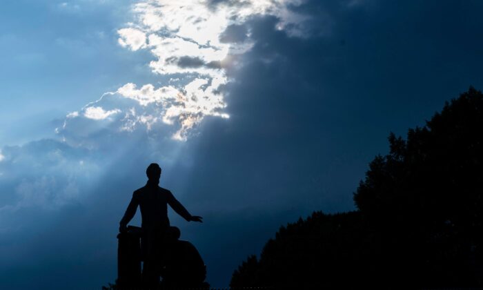 The Emancipation Memorial is seen as a storm moves in at Lincoln Park in Washington on June 25, 2020. (Andrew Caballero-Reynolds/AFP via Getty Images)