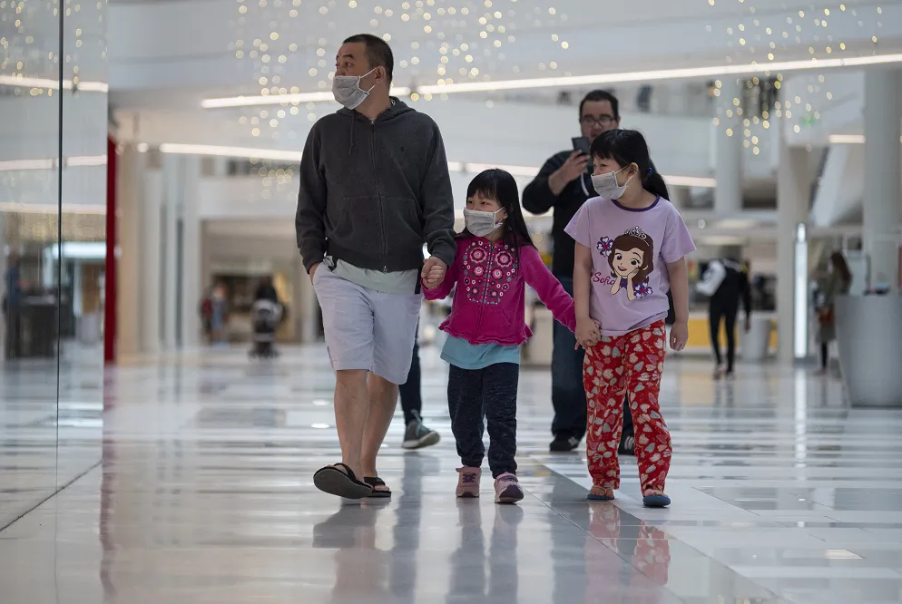 People wear masks as they walk through the Mall of America in Minneapolis, Minnesota, on June 10, 2020. (Stephen Maturen/Getty Images)