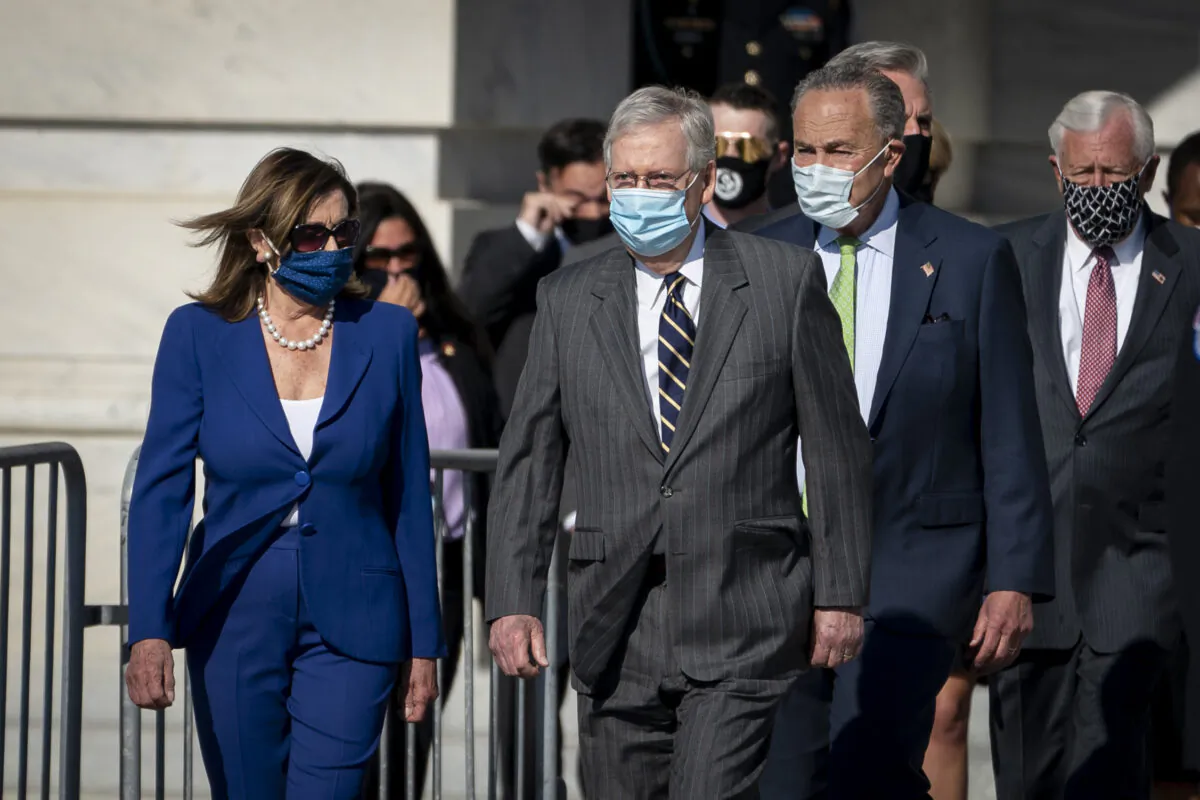 Speaker of the House Nancy Pelosi (D-CA), Senate Majority Leader Mitch McConnell (R-KY), Senate Minority Leader Chuck Schumer (D-NY) and Rep. Steny Hoyer (D-MD) walk outside before the casket of the late civil rights icon Rep. John Lewis (D-GA) departs the United States Capitol in Washington on July 29, 2020. (Drew Angerer/Getty Images)