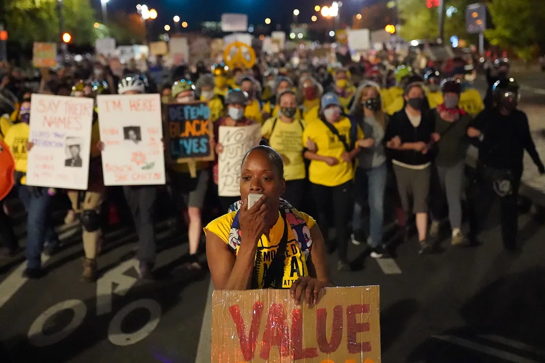Moms United for Black Lives Matter march up Salmon Street in front of the Mark O. Hatfield U.S. Courthouse in Portland on July 31, 2020. (Nathan Howard/Getty Images)