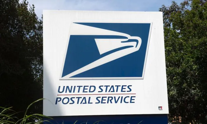 The USPS logo is seen in front of the Los Angeles Plant in Los Angeles, Calif., on April 29, 2020. (Valerie Macon/AFP via Getty Images)