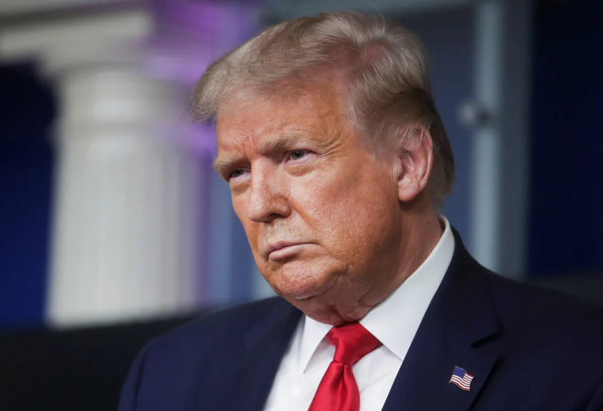 President Donald Trump listens to a question from a reporter during a briefing in the Brady Press Briefing Room of the White House in Washington on Aug. 3, 2020. (Jonathan Ernst/Reuters)