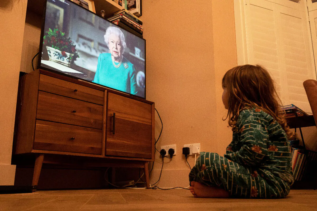 In this file photo, Isaac (4) watches Queen Elizabeth II during a televised address to the nation in London, Britain, on April 5, 2020. (Reuters/Simon Dawson/File Photo)