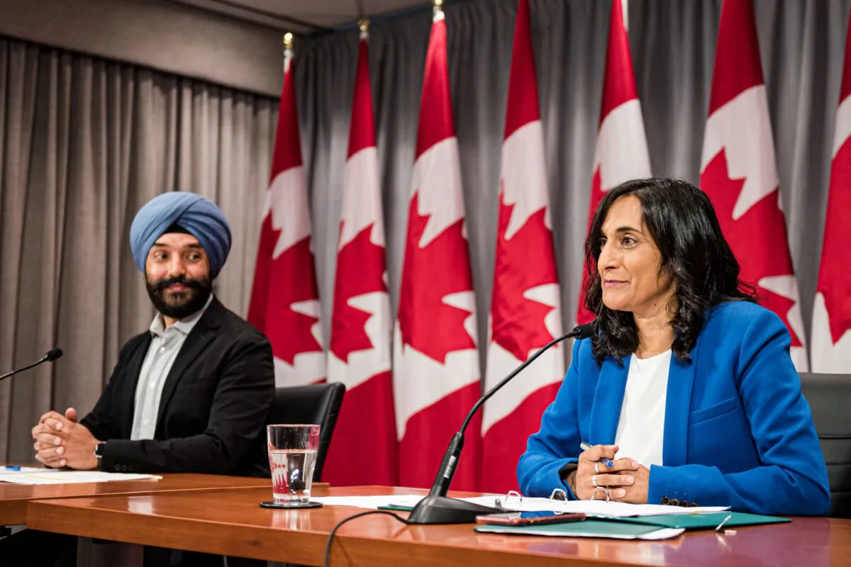 Navdeep Bains, Minister of Innovation, Science and Industry and Anita Anand, Minister of Public Services and Procurement make an announcement regarding vaccine procurement, in Toronto, on Wed., Aug., 5, 2020. (THE CANADIAN PRESS/Christopher Katsarov)