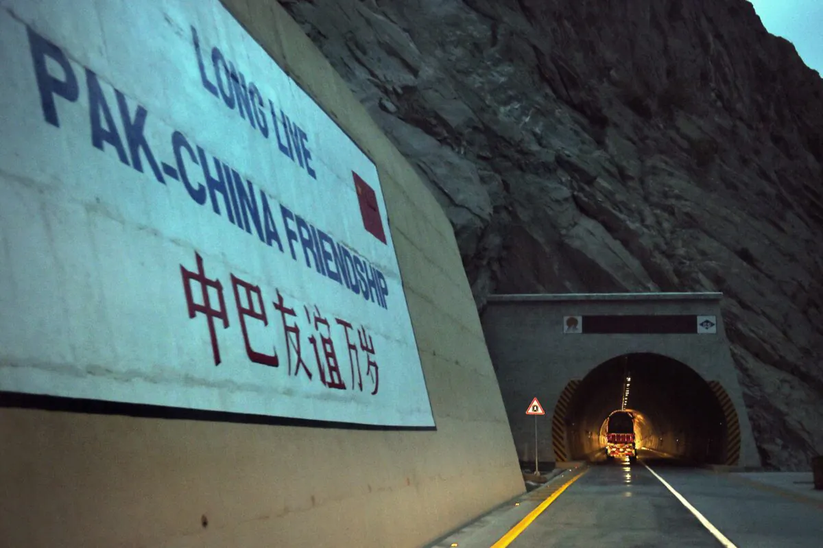 A loaded truck travels through a newly built tunnel in northern Pakistan's Gojal Valley on Sept. 29, 2015. (Aamir Qureshi/AFP via Getty Images)