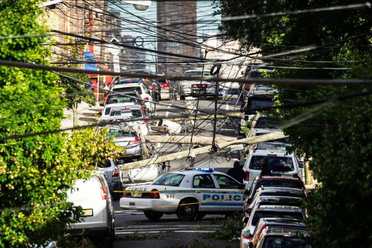 Power lines criss-cross at street level after Tropical Storm Isaias and its high winds and heavy rain passed through Guttenberg, N.J., on Aug. 4, 2020. (Eduardo Munoz Alvarez/Getty Images)