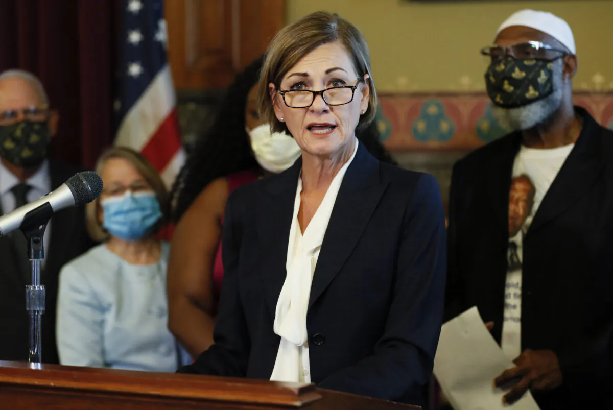 Iowa Gov. Kim Reynolds speaks after signing an executive order granting convicted felons the right to vote during a signing ceremony at the Statehouse in Des Moines, Iowa, on Aug. 5, 2020. (Charlie Neibergall/AP Photo)