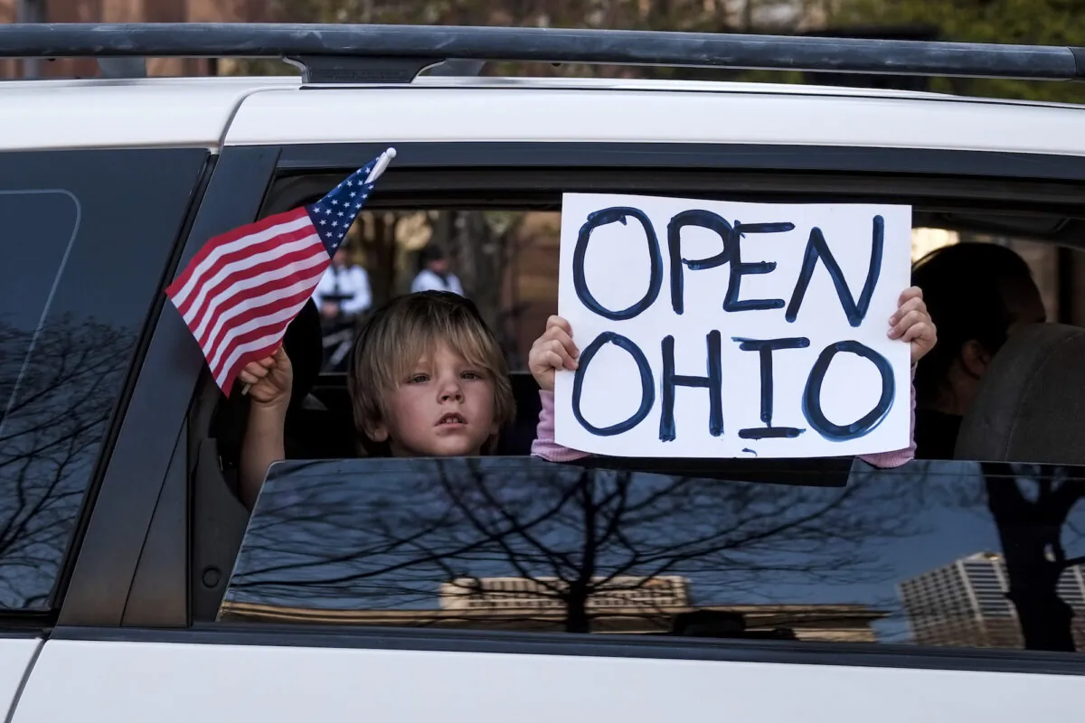 Protesters gather at the Ohio Statehouse to protest the stay-at-home order in Columbus, Ohio, on April 20, 2020. (Matthew Hatcher/Getty Images)
