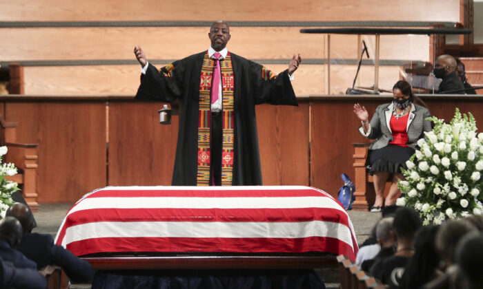Rev. Raphael Warnock offers a benediction at the funeral service of the late Rep. John Lewis (D-Ga.) at Ebenezer Baptist Church in Atlanta, Ga., on July 30, 2020. He was elected to the U.S. Senate six months later.(Alyssa Pointer/Pool/Getty Images)