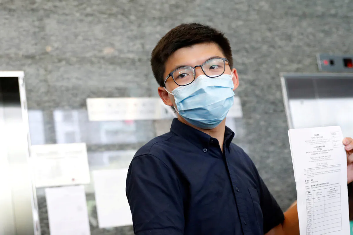 Pro-democracy activist Joshua Wong registers as a candidate for the upcoming Legislative Council election in Hong Kong on July 20, 2020. (Tyrone Siu/Reuters)