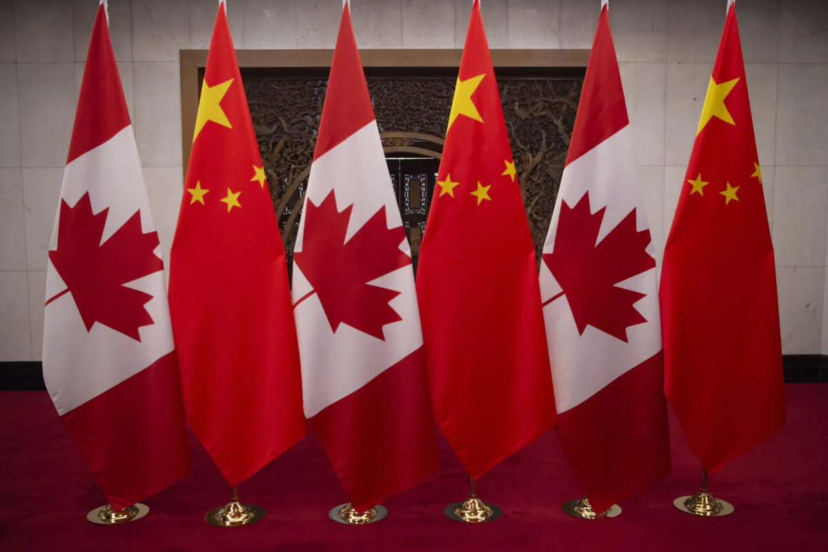 Canadian and Chinese flags taken prior to a meeting with Canada's Prime Minister Justin Trudeau and China's President Xi Jinping at the Diaoyutai State Guesthouse in Beijing, China, on Dec. 5, 2017. (Fred Dufour / POOL /AFP via Getty Images)