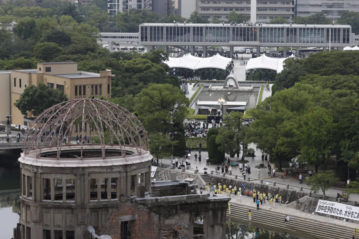The Atomic Bomb Dome is seen in front of the venue holding a ceremony to mark the 75th anniversary of the atomic bombing at the Hiroshima Peace Memorial Park in Hiroshima, western Japan on Aug. 6, 2020, the 75th anniversary of the atomic bombing.  (Kyodo/via Reuters)