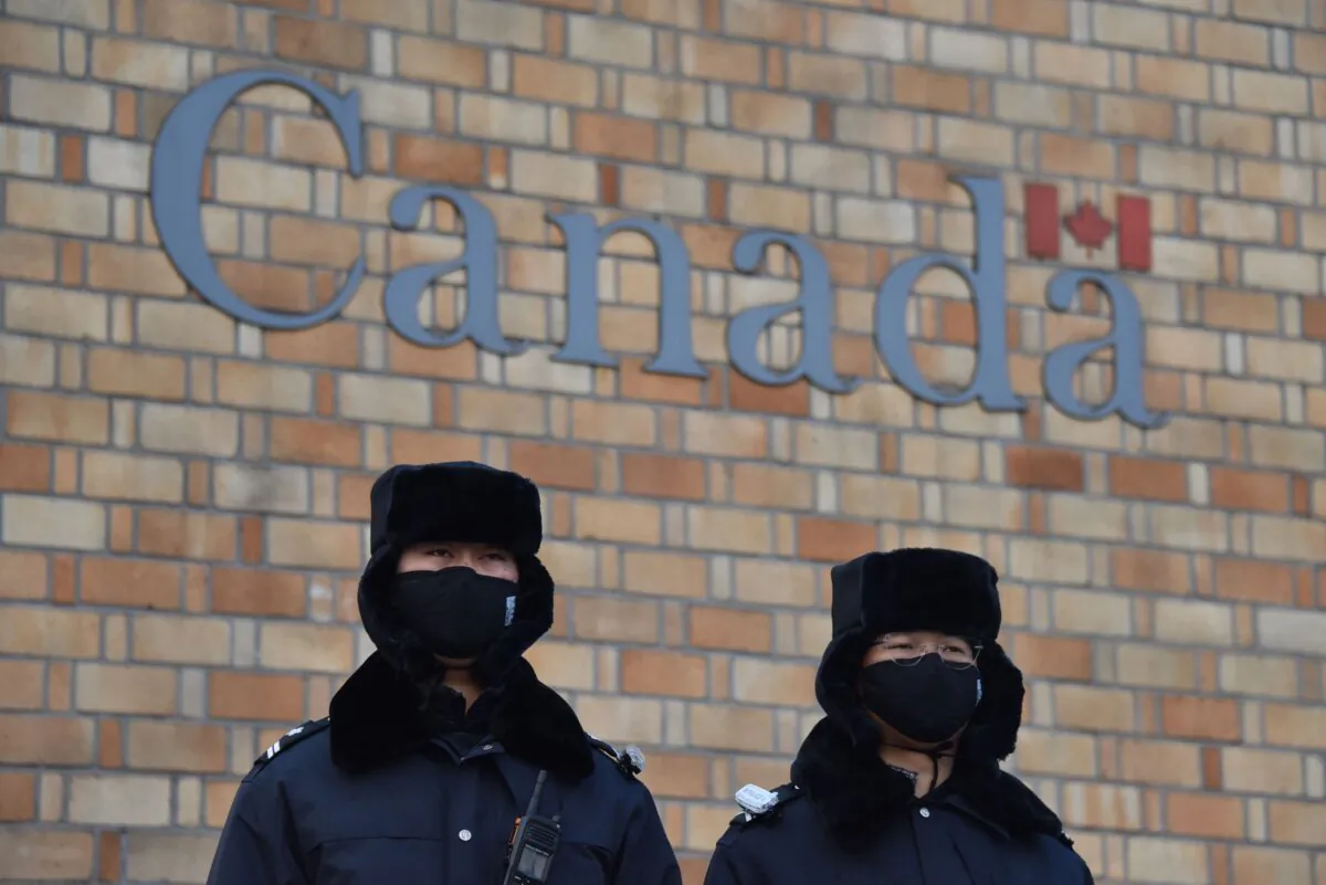 Chinese police officers stand guard outside the Canadian embassy in Beijing on Dec. 10, 2018. (Greg Baker/AFP via Getty Images)
