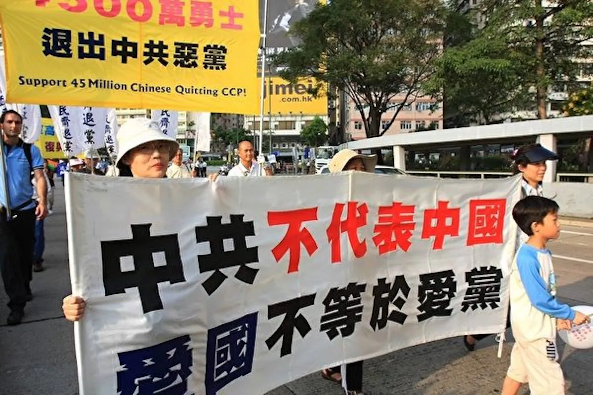 Chinese people participate in a rally to support the 45 million Chinese who have quit the Chinese Communist Party (CCP) in this undated photo. The banner says, "The CCP does not equal China, and patriotism does not equal loving the Communist Party." (Li Ming/The Epoch Times)